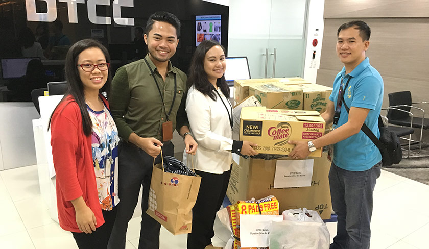 Employees at a food drive